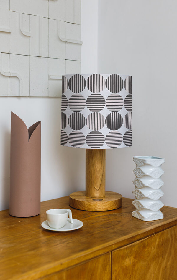 patterned lampshade on a sideboard