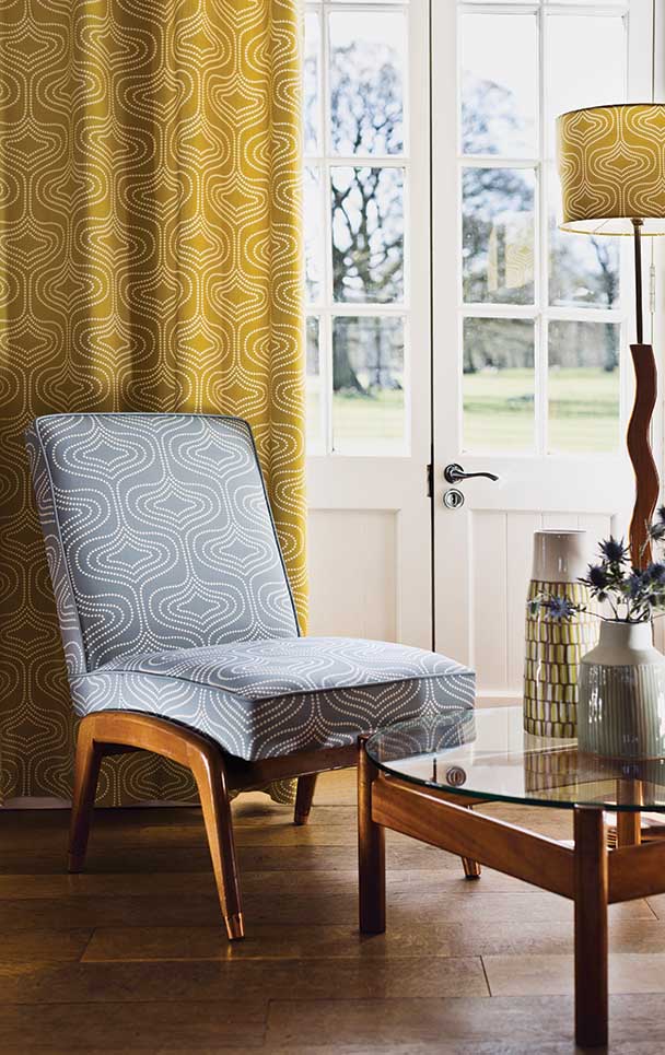 mustard curtains and blue patterned chair
